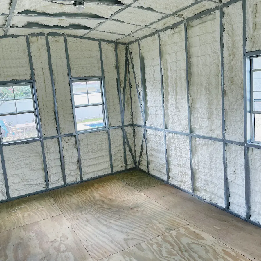 Closed-cell spray foam insulation applied to wall cavities in a residential project in Kenosha